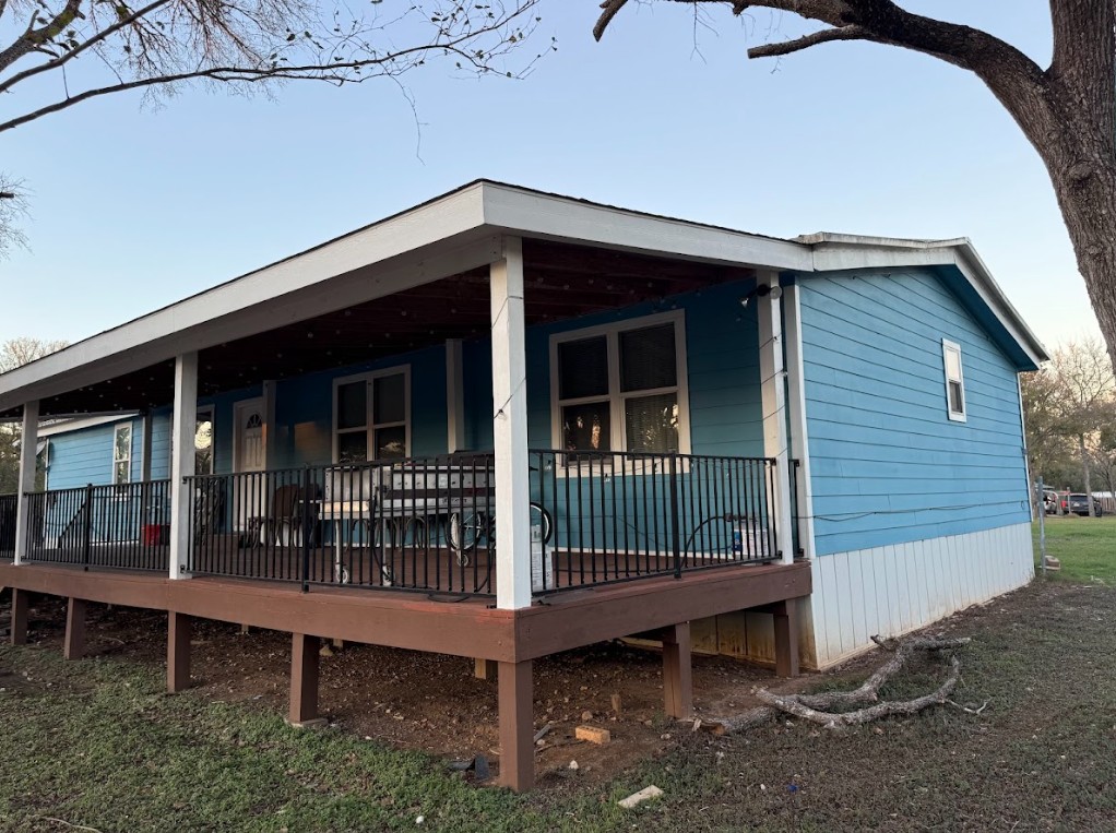 176 Pearson Road Dale, TX 78616 - Photo 18 of 39 a view of a house with a yard and wooden deck