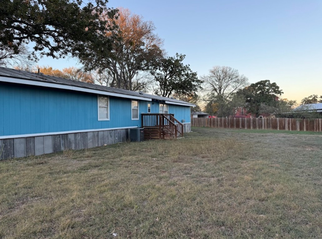 176 Pearson Road Dale, TX 78616 - Photo 22 of 39 a view of a house with a backyard