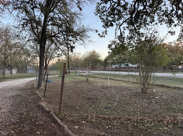 a kitchen with refrigerator a sink and cabinets
