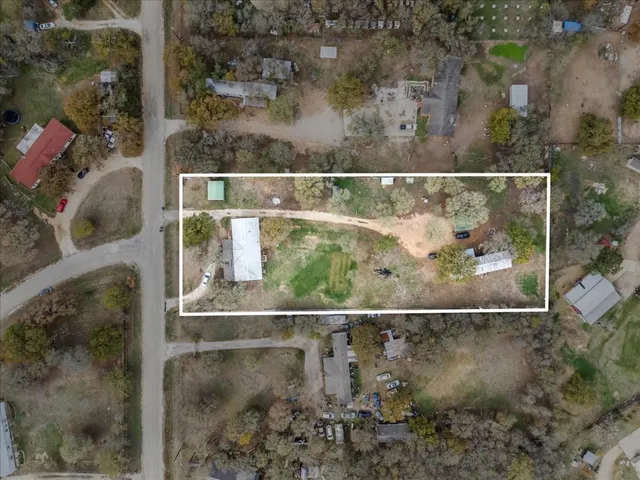 a view of a house with a yard and porch