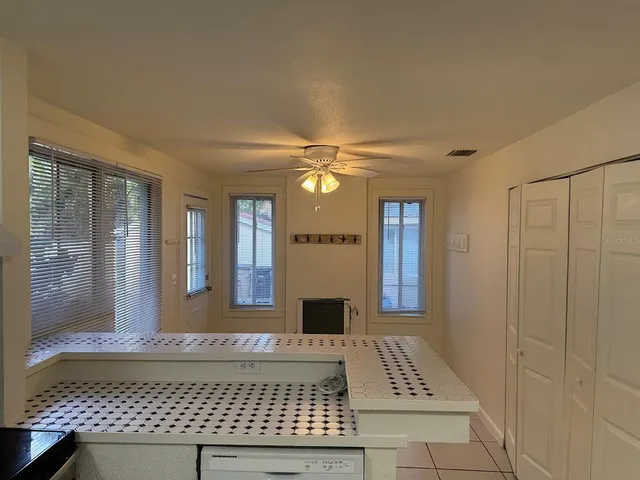 a white toilet sitting next to a bathroom sink