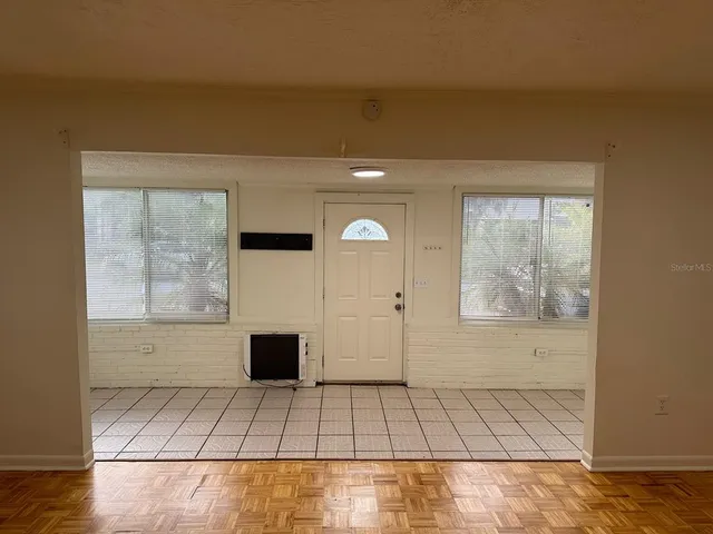 a view of an empty room with a window