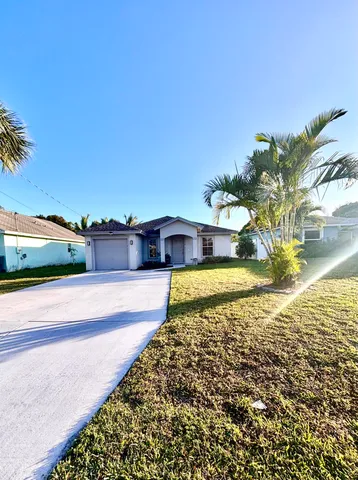 a view of a swimming pool and an outdoor space
