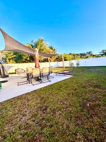 a view of a swimming pool and lounge chair