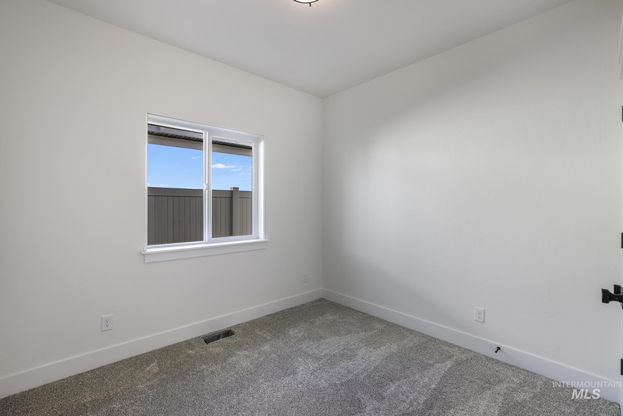 921 Adamite Road Kimberly, ID 83341 - Photo 16 of 25 Unfurnished room with carpet floors and baseboards