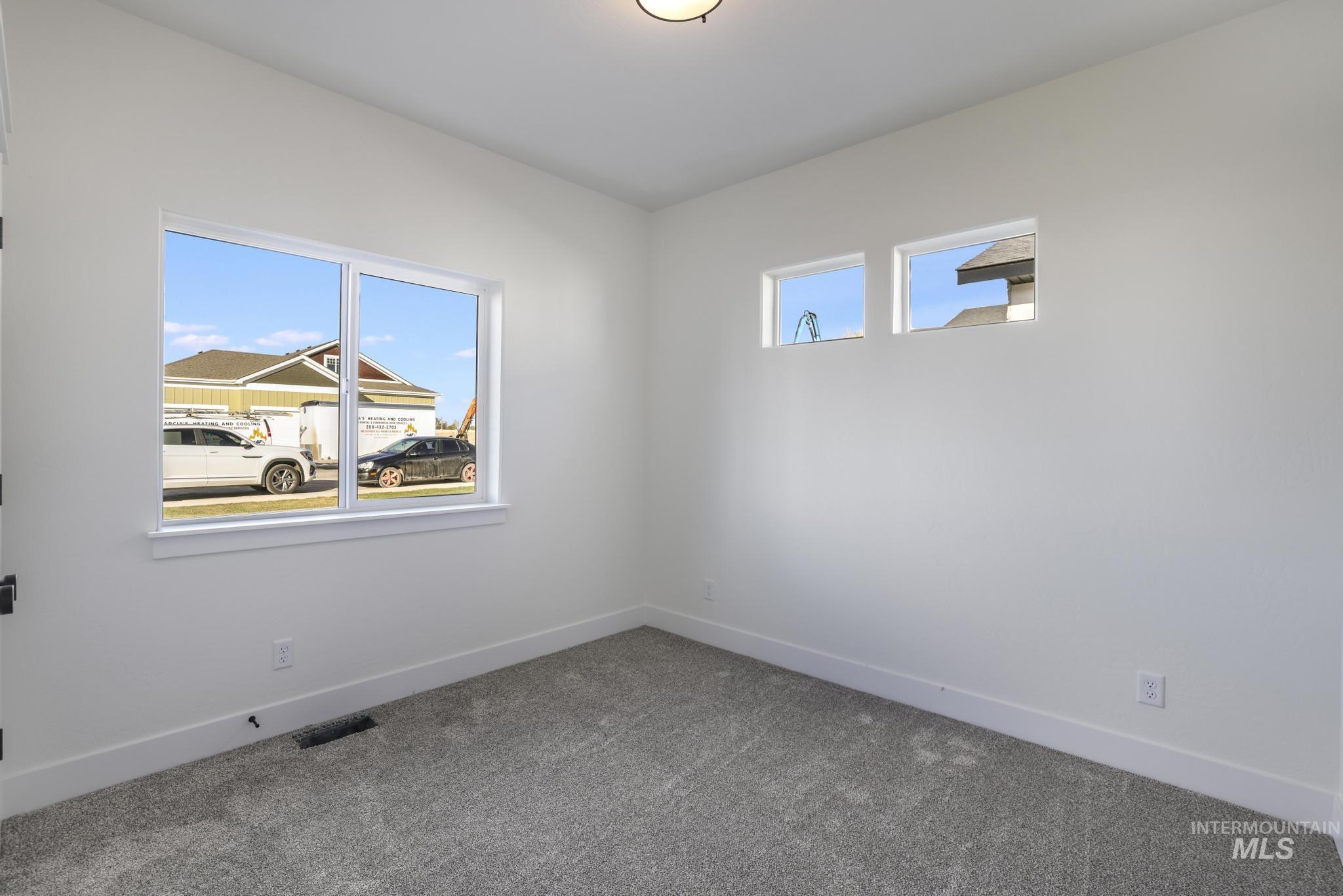 921 Adamite Road Kimberly, ID 83341 - Photo 19 of 25 Carpeted spare room featuring baseboards