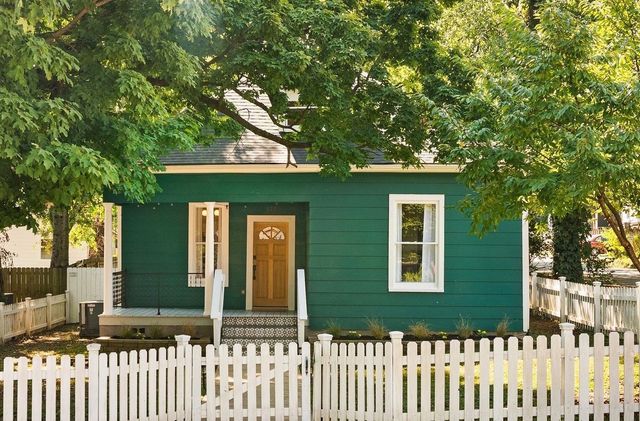 a front view of a house with a small yard