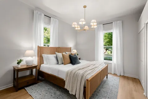 a bedroom with a bed and a closet