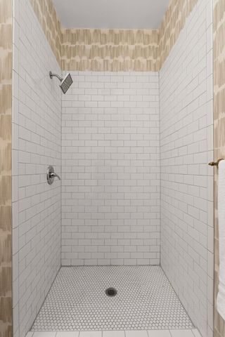 a en suite bathroom with a double vanity sink and a mirror