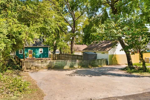 a backyard of a house with lots of green space
