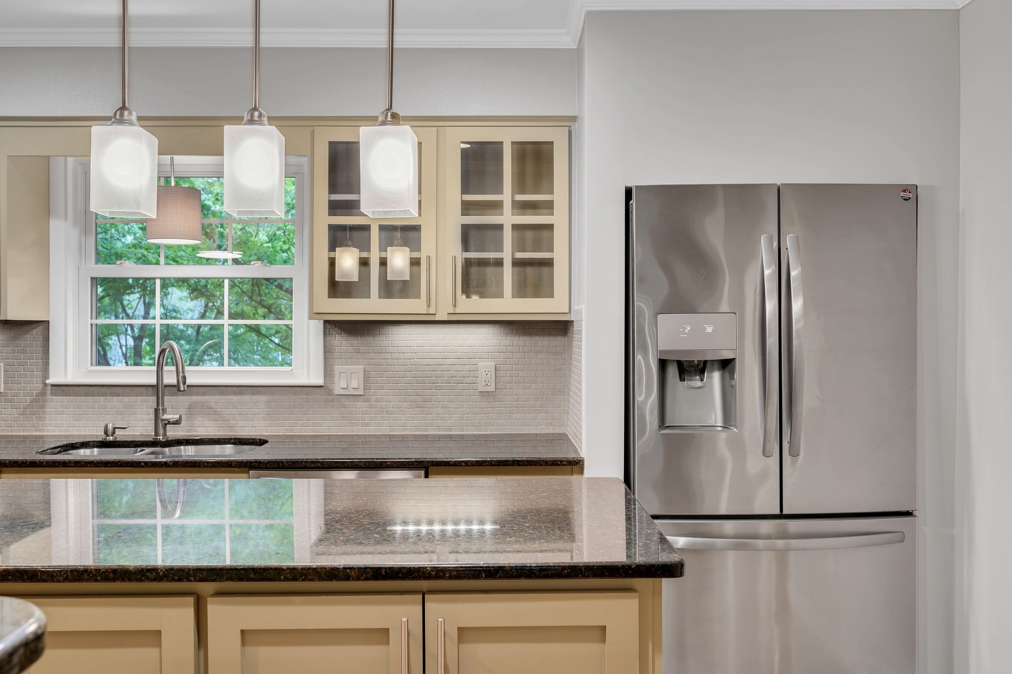 6620 Ellesmere Road Nashville, TN 37205 - Photo 14 of 45 Modern, sleek and fully equipped- this updated kitchen features stainless steel appliances, granite countertops, new lighting, tile flooring and backblash, and a large island for prepping your favorite meals.