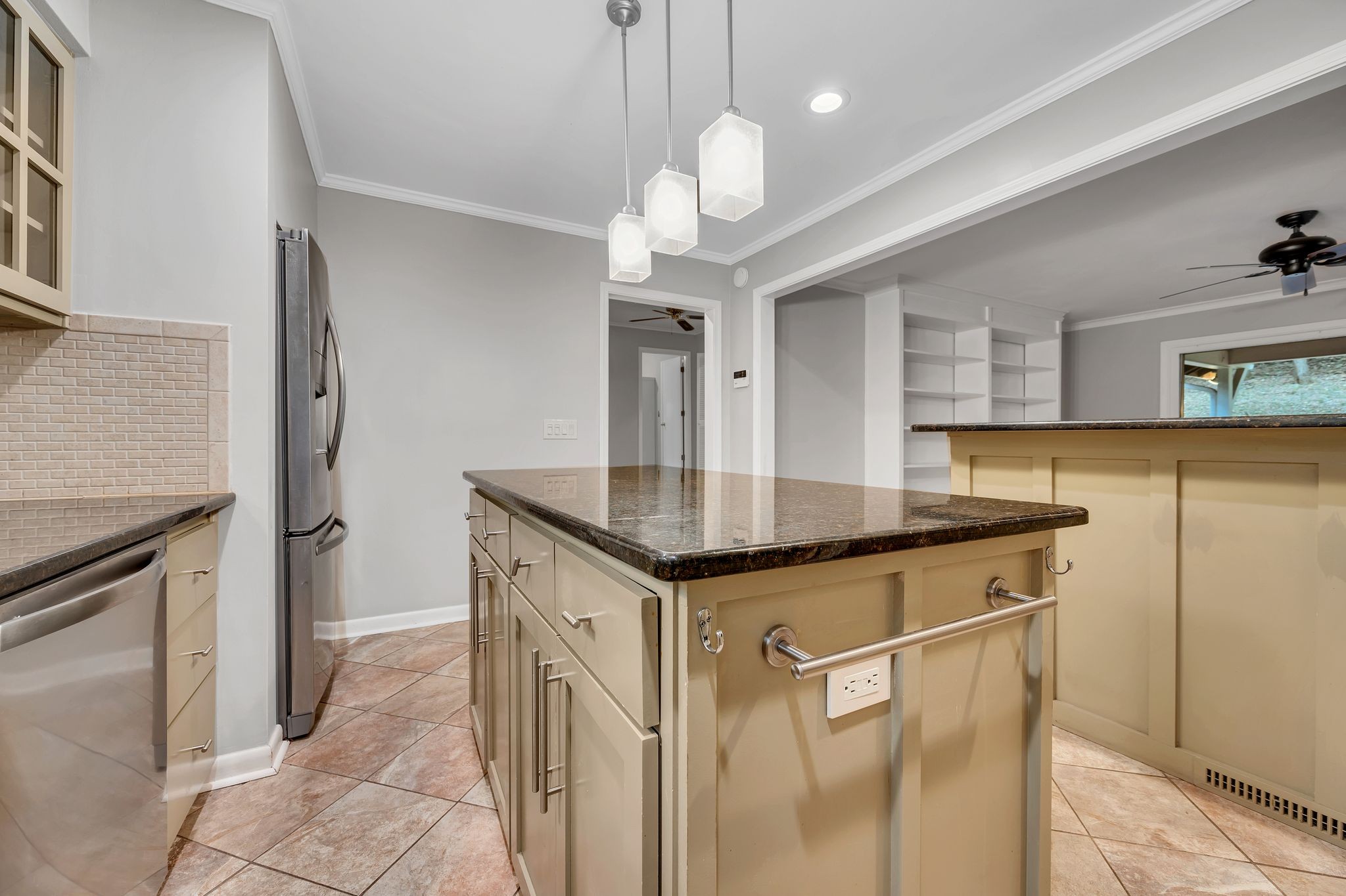 6620 Ellesmere Road Nashville, TN 37205 - Photo 17 of 45 Modern, sleek and fully equipped- this updated kitchen features stainless steel appliances, granite countertops, new lighting, tile flooring and backblash, and a large island for prepping your favorite meals.