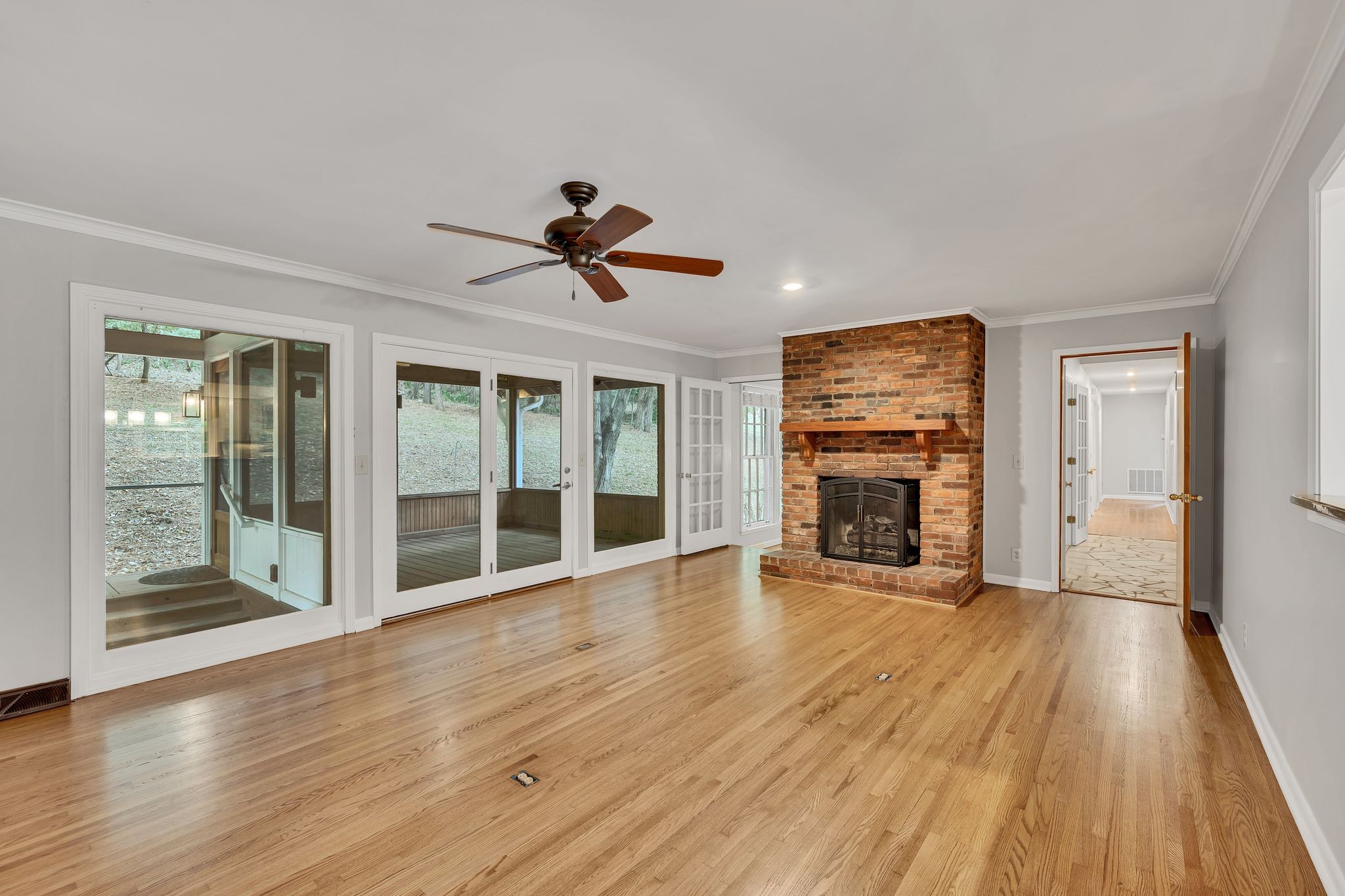 6620 Ellesmere Road Nashville, TN 37205 - Photo 20 of 45 Unwind in the cozy den, complete with a gas fireplace, built-in bookshelves, and serene views of the beautiful backyard.