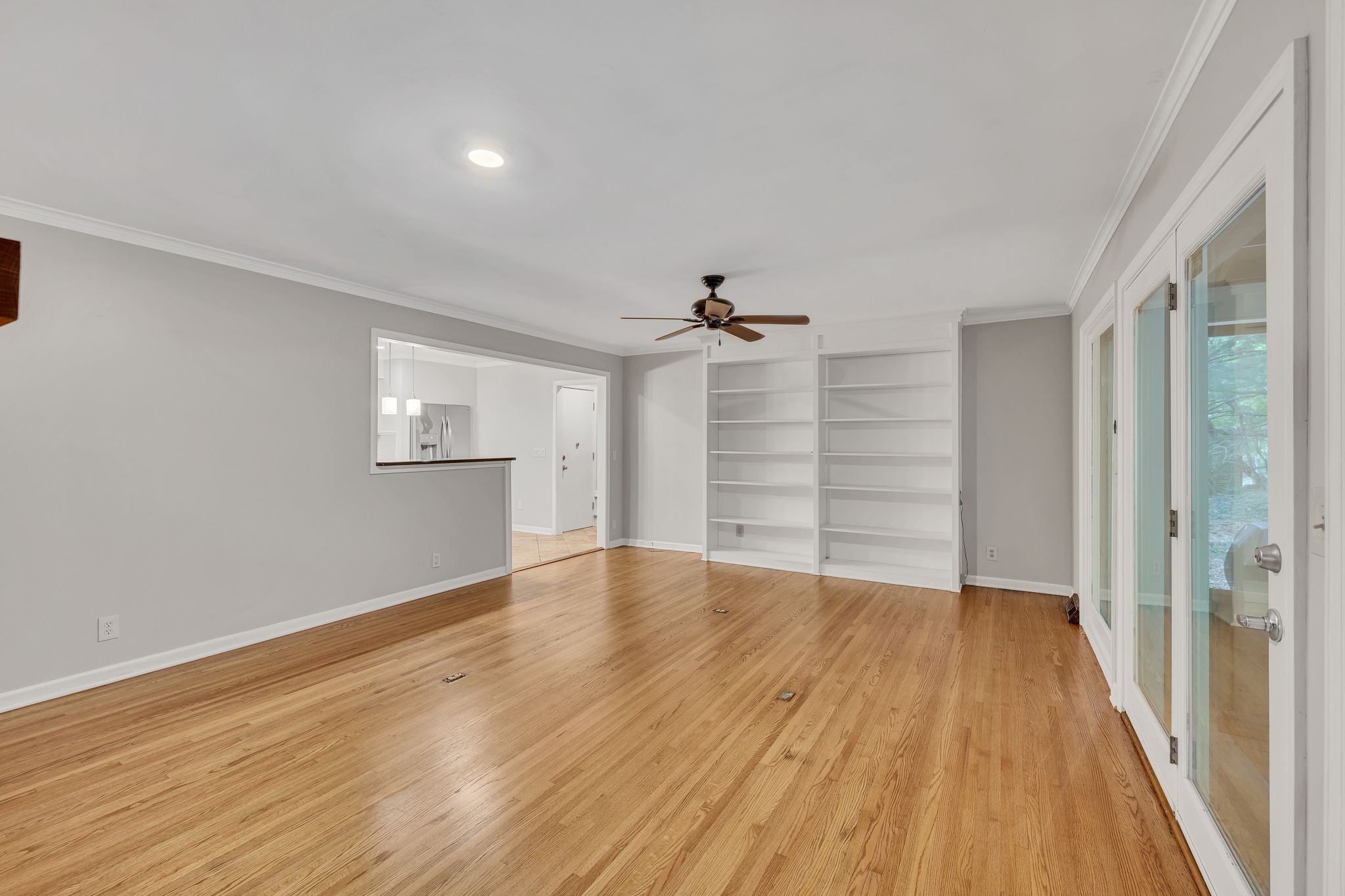 6620 Ellesmere Road Nashville, TN 37205 - Photo 21 of 45 Unwind in the cozy den, complete with a gas fireplace, built-in bookshelves, and serene views of the beautiful backyard.