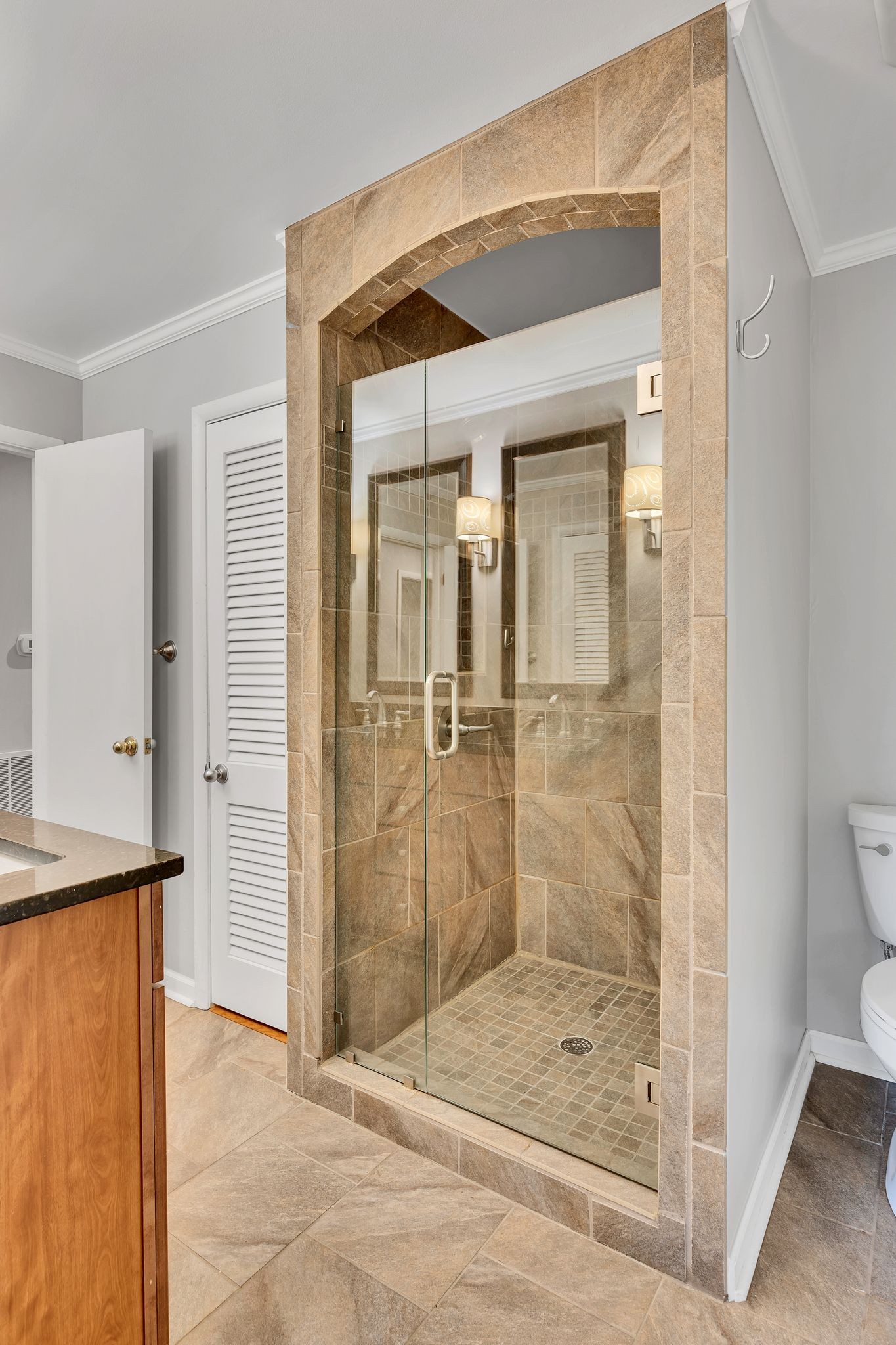 6620 Ellesmere Road Nashville, TN 37205 - Photo 29 of 45 Updated second bathroom features a large walk-in tile shower, and double vanities.