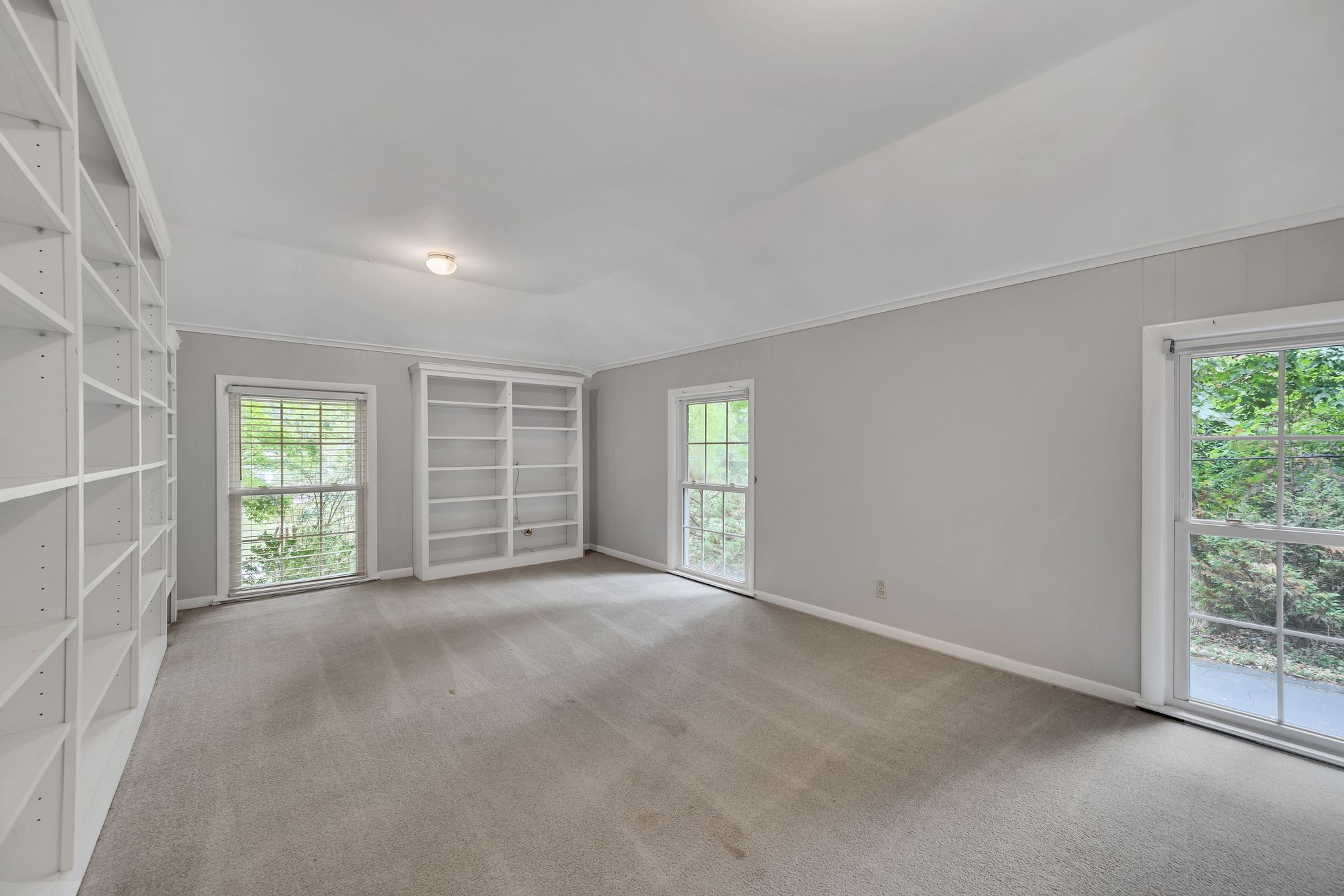 6620 Ellesmere Road Nashville, TN 37205 - Photo 37 of 45 This roomy library with expansive bookshelves provides the perfect spot for reading or studying.
