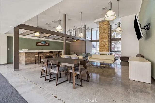 a dinning table and chairs in a room