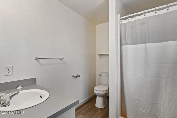 a white toilet sitting next to a bathroom sink