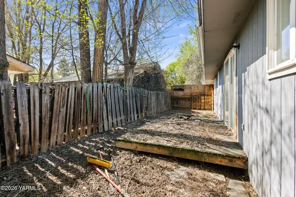 a view of a backyard with a trees