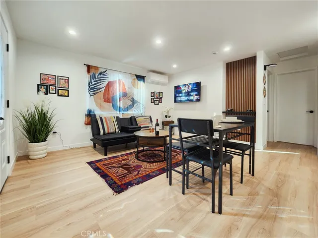 a living room with furniture and a rug