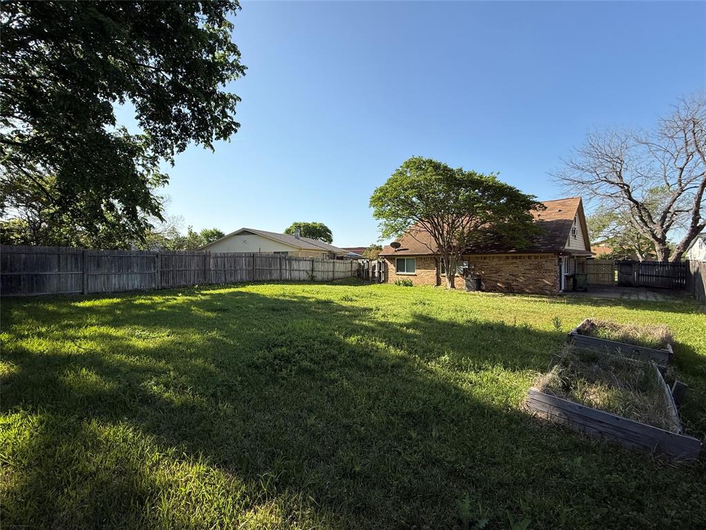 3005 Meandering Way Bedford, TX 76021 - Photo 22 of 22 a view of yard with swimming pool and green space