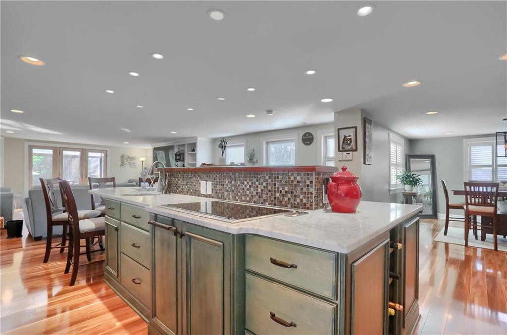 24 Herbst Road Coraopolis, PA 15108 - Photo 17 of 50 a kitchen with a stove a refrigerator and a dining table