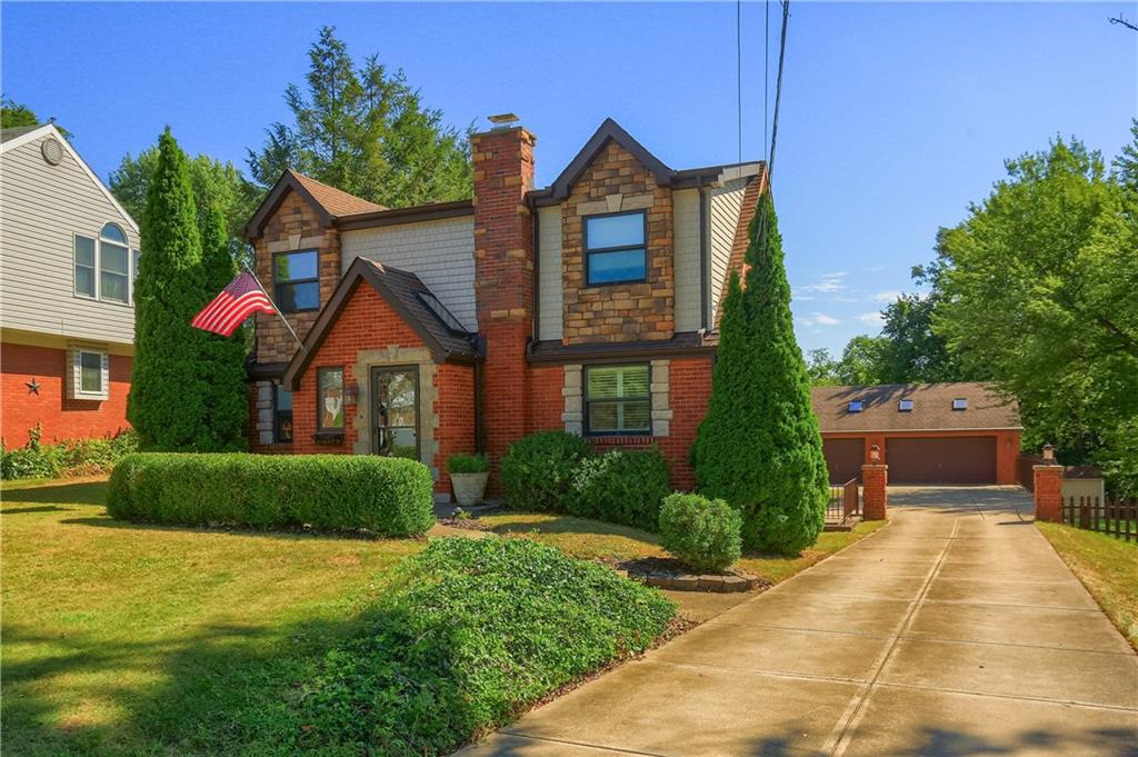 24 Herbst Road Coraopolis, PA 15108 - Photo 2 of 50 a front view of a house with garden