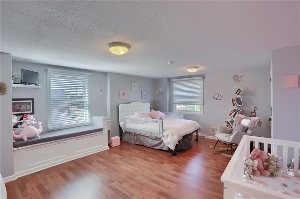 24 Herbst Road Coraopolis, PA 15108 - Photo 31 of 50 a spacious bedroom with a bed and a window