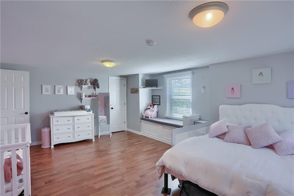 24 Herbst Road Coraopolis, PA 15108 - Photo 32 of 50 a bedroom with furniture and a wooden floor