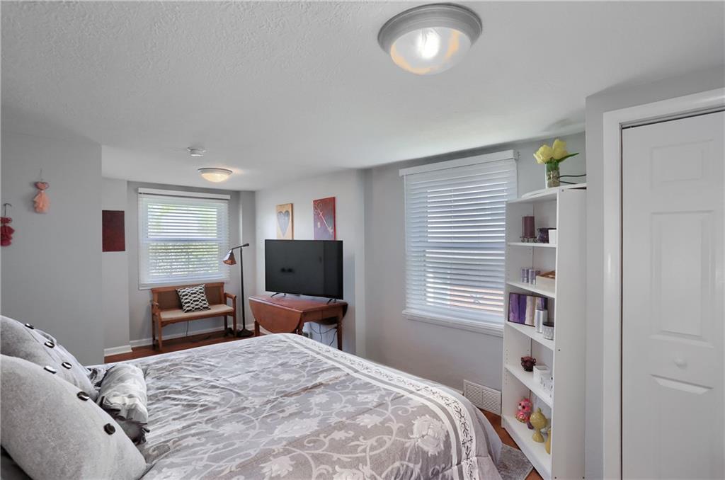 24 Herbst Road Coraopolis, PA 15108 - Photo 34 of 50 a bedroom with a bed and a flat screen tv