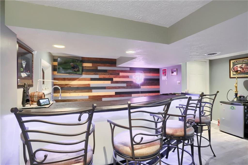 24 Herbst Road Coraopolis, PA 15108 - Photo 40 of 50 a view of a dining room with furniture and wooden floor