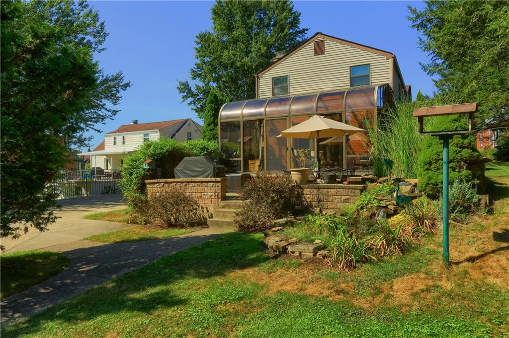 24 Herbst Road Coraopolis, PA 15108 - Photo 46 of 50 a front view of a house with garden