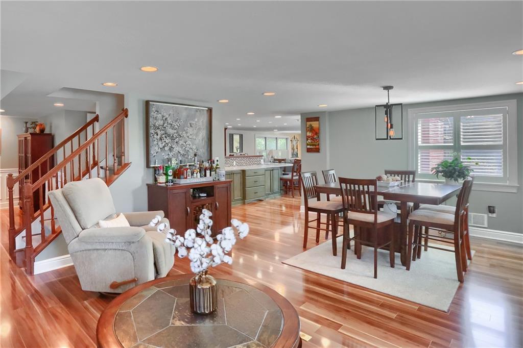 24 Herbst Road Coraopolis, PA 15108 - Photo 7 of 50 a living room with furniture a dining table and a large window