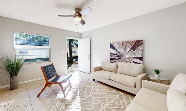 a living room with furniture and a large window