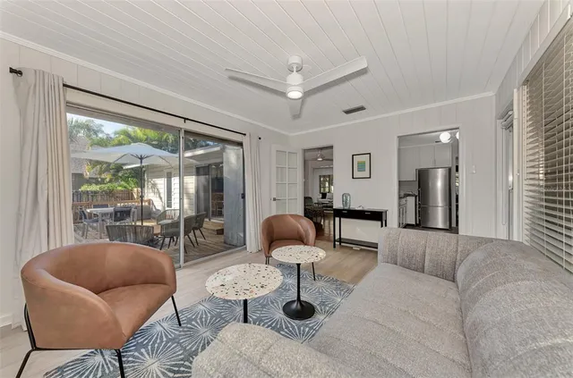a bedroom with a bed lamp and a window