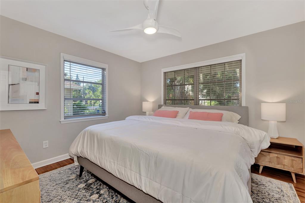 1726 Floyd Street Sarasota, FL 34239 - Photo 25 of 52 a bedroom with a bed lamp and a window