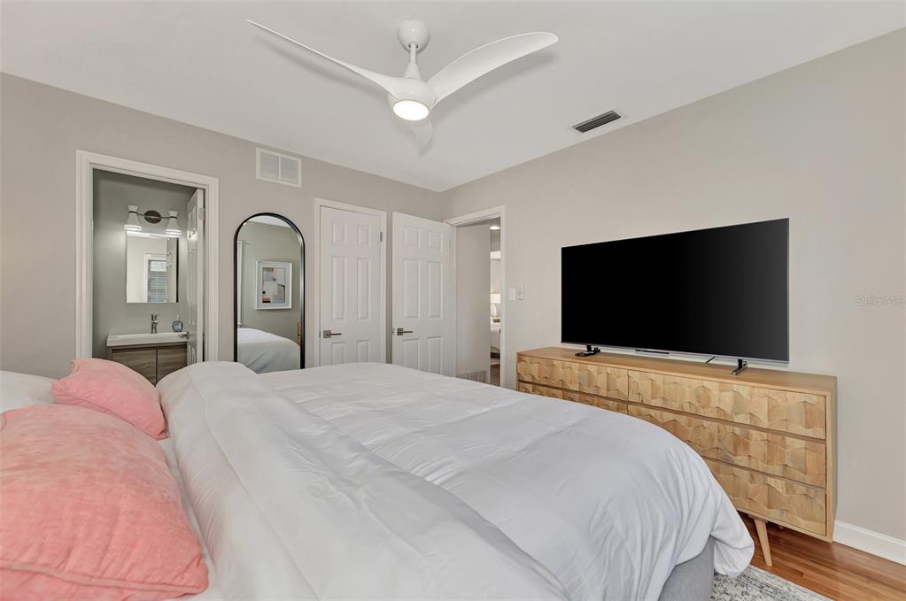 1726 Floyd Street Sarasota, FL 34239 - Photo 26 of 52 a bedroom with a bed and a flat screen tv