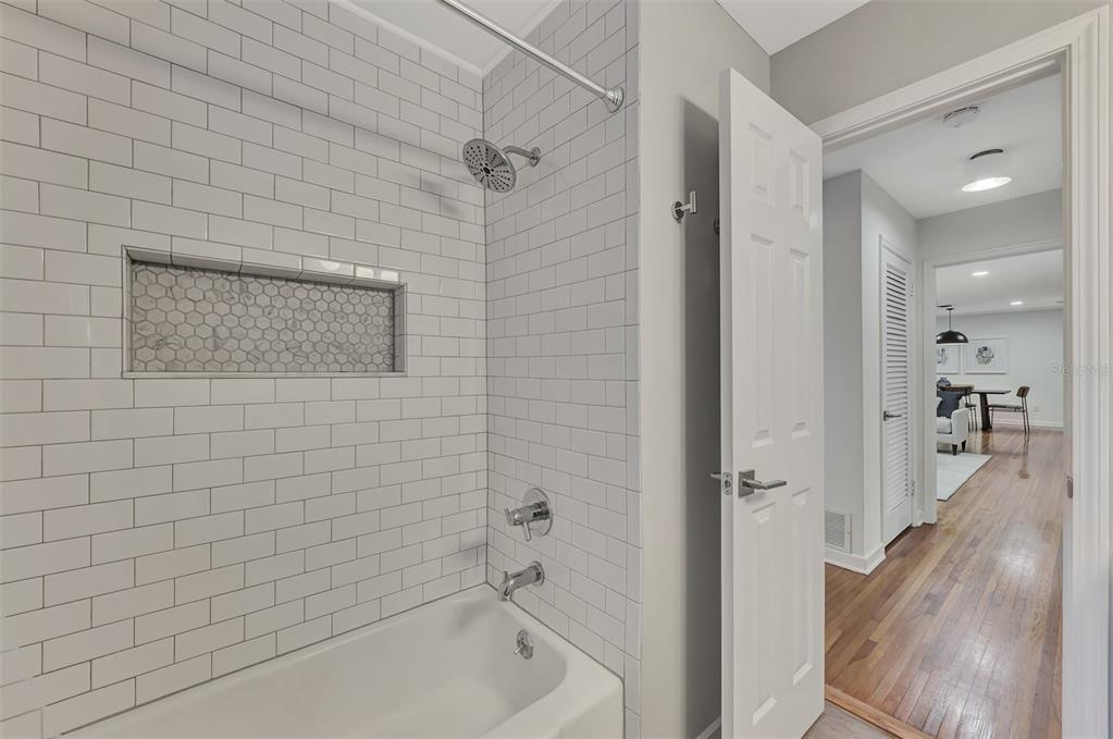 1726 Floyd Street Sarasota, FL 34239 - Photo 31 of 52 a bathroom with a bathtub and a shower