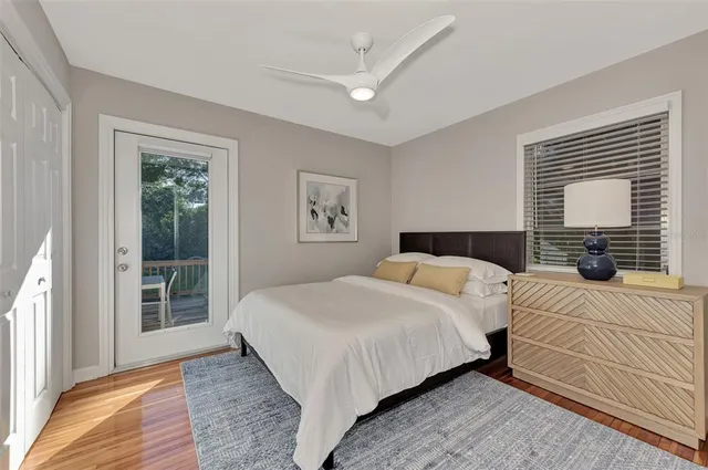 a bedroom with double bed and a wooden floor