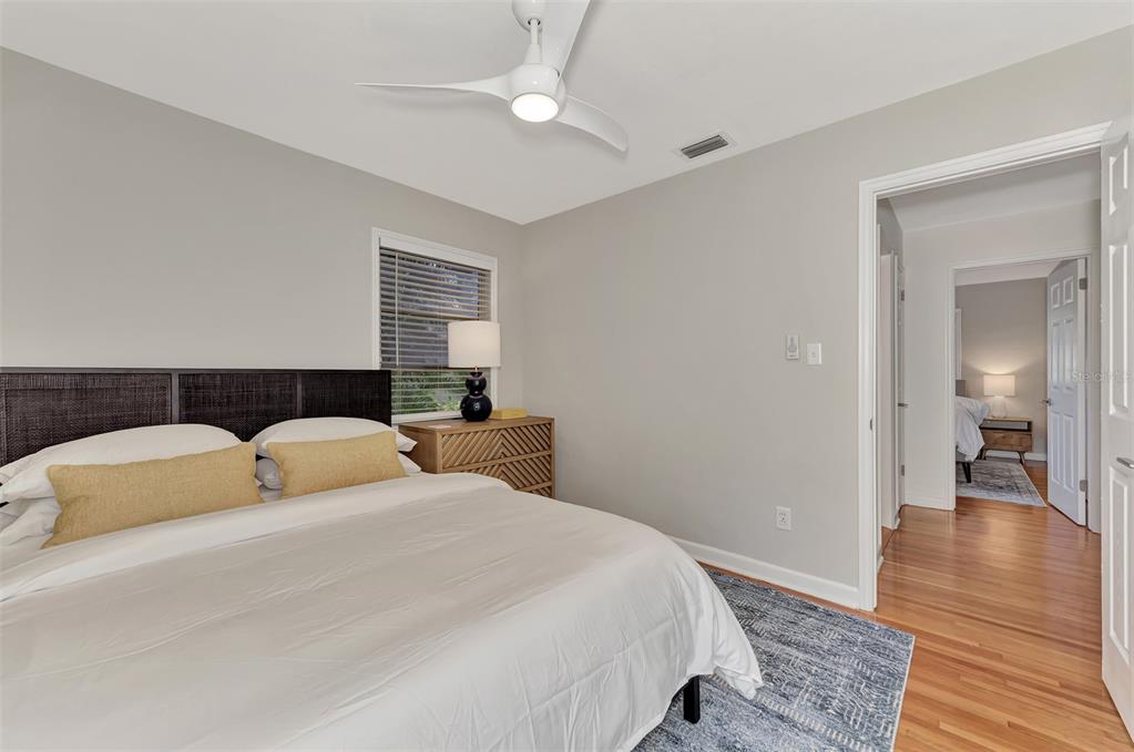 1726 Floyd Street Sarasota, FL 34239 - Photo 33 of 52 a bedroom with double bed and a wooden floor