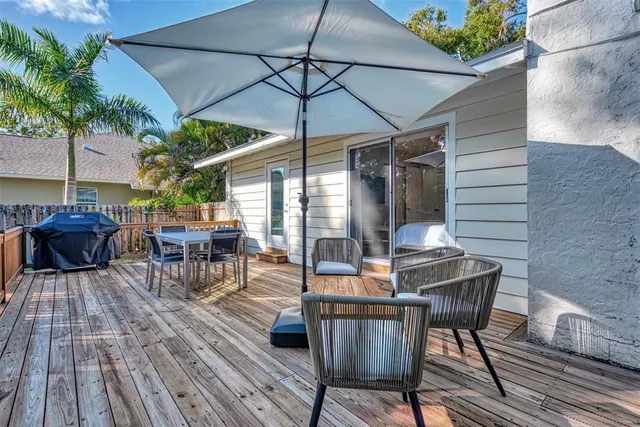 an outdoor space with furniture and umbrella