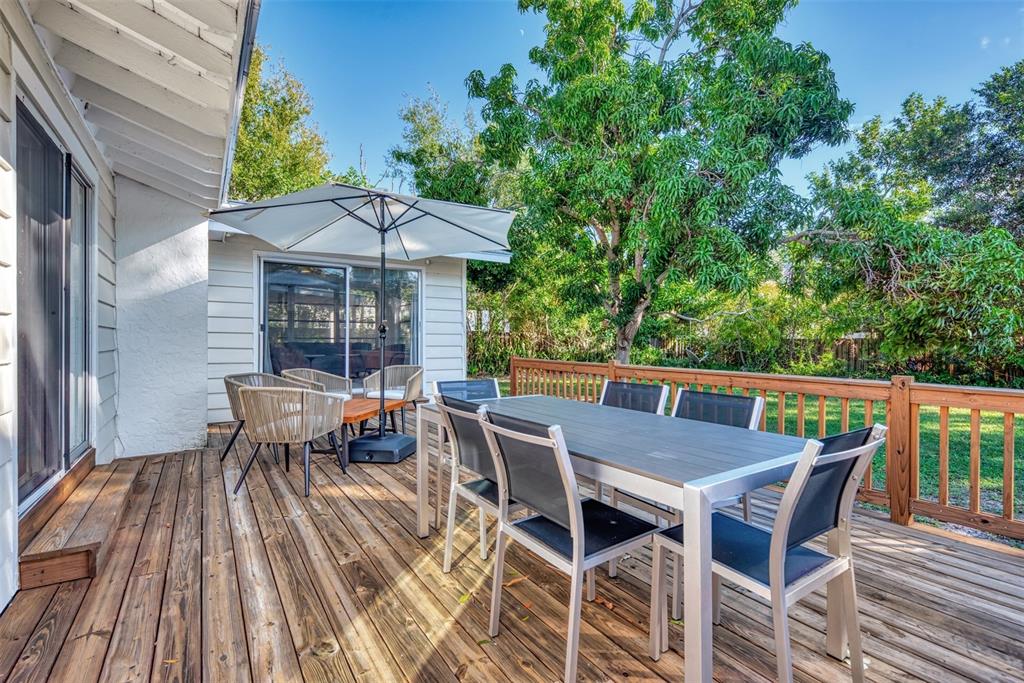 1726 Floyd Street Sarasota, FL 34239 - Photo 36 of 52 an outdoor space with furniture and umbrella