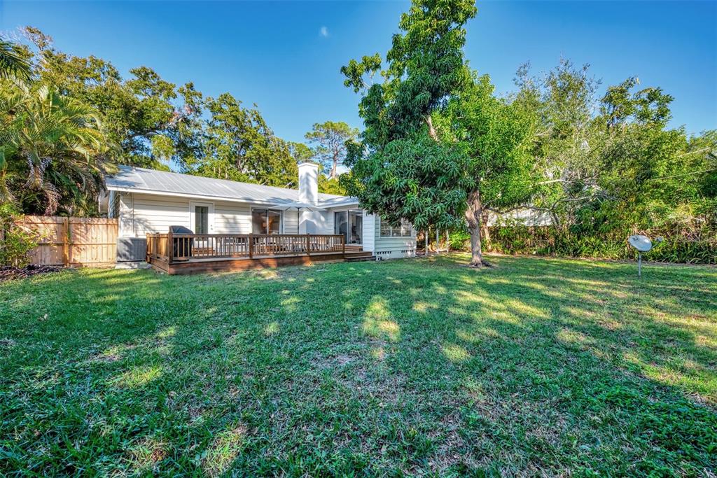 1726 Floyd Street Sarasota, FL 34239 - Photo 40 of 52 a view of a house with a backyard porch and sitting area