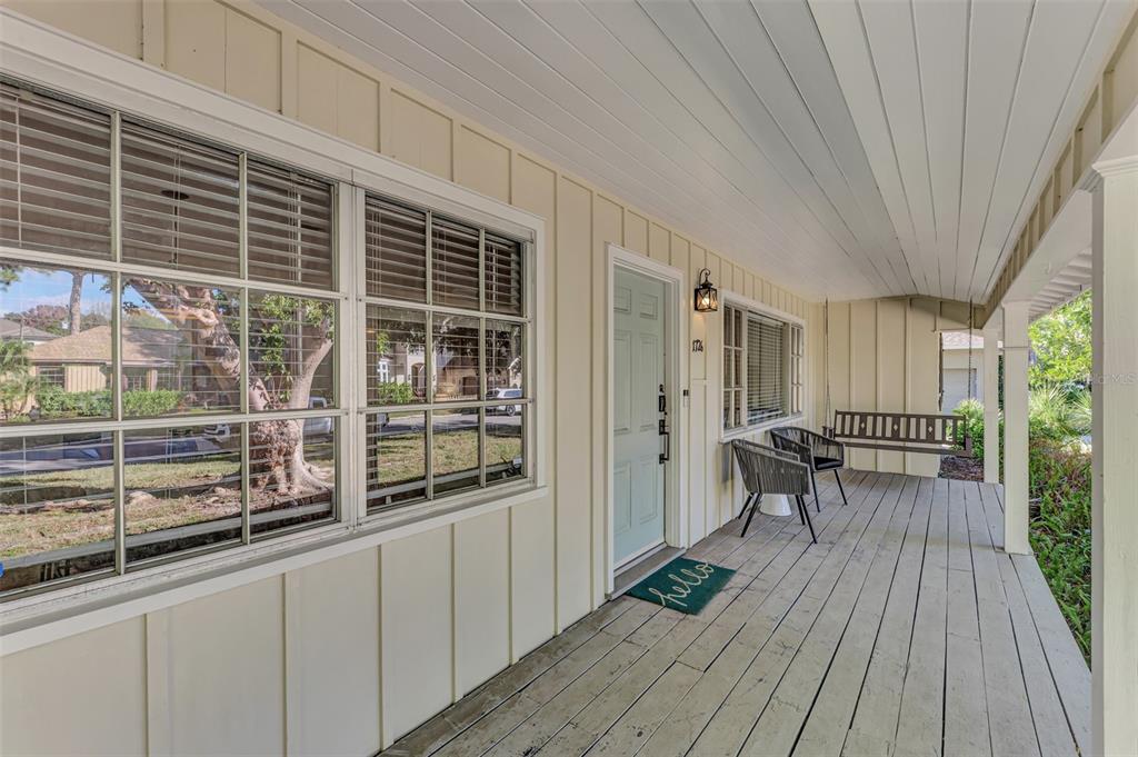 1726 Floyd Street Sarasota, FL 34239 - Photo 4 of 52 a view of a balcony with chairs and wooden floor