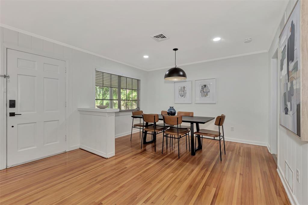 1726 Floyd Street Sarasota, FL 34239 - Photo 5 of 52 a view of a dining room with furniture and wooden floor