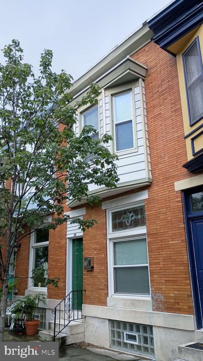 a front view of a house with a garage