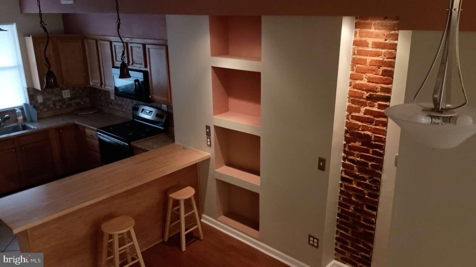 28 South Potomac Street Baltimore, MD 21224 - Photo 16 of 20 a kitchen with a refrigerator and a sink