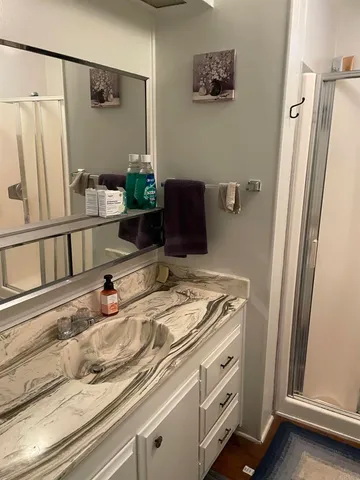 a bathroom with a sink and a mirror
