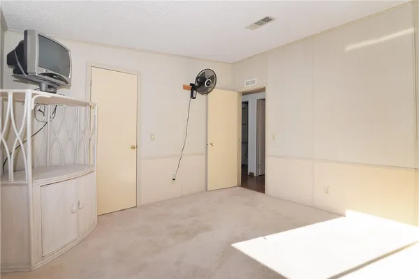 a view of a livingroom with a kitchen