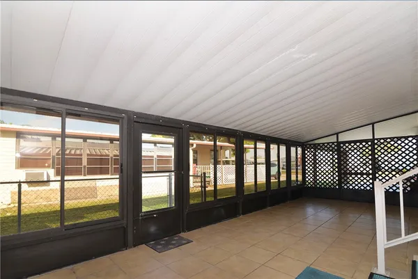 a view of an empty room with a balcony